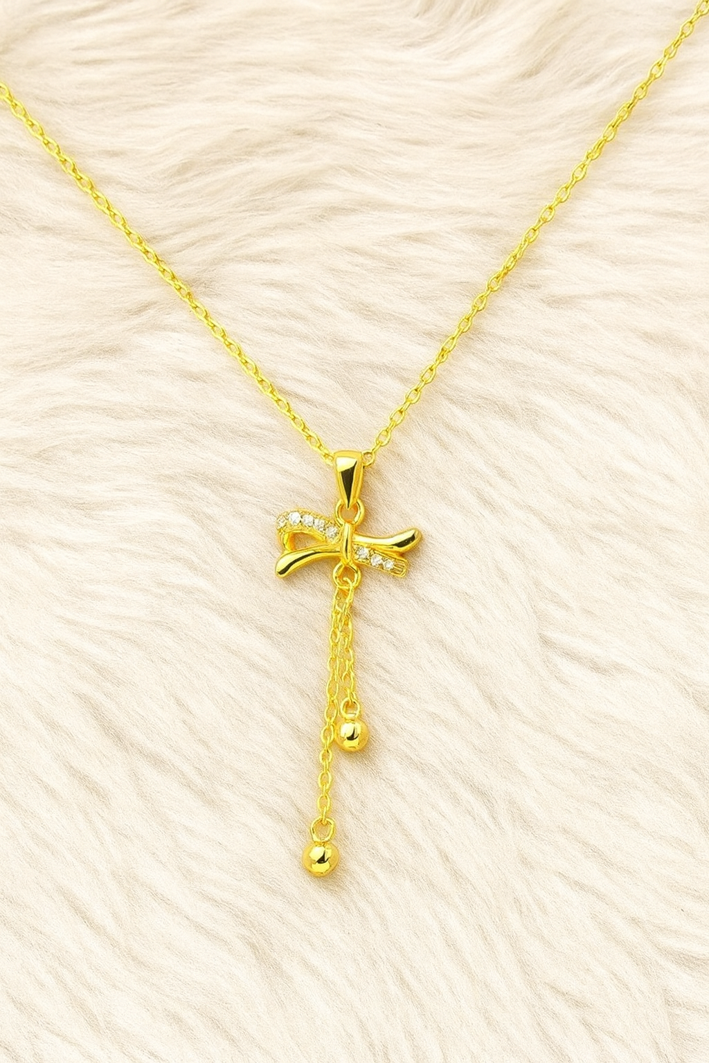Golden Whisper Bow Pendant