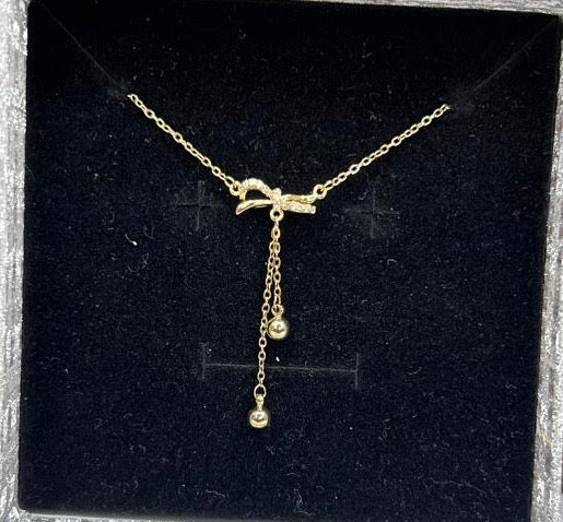 Golden Whisper Bow Pendant