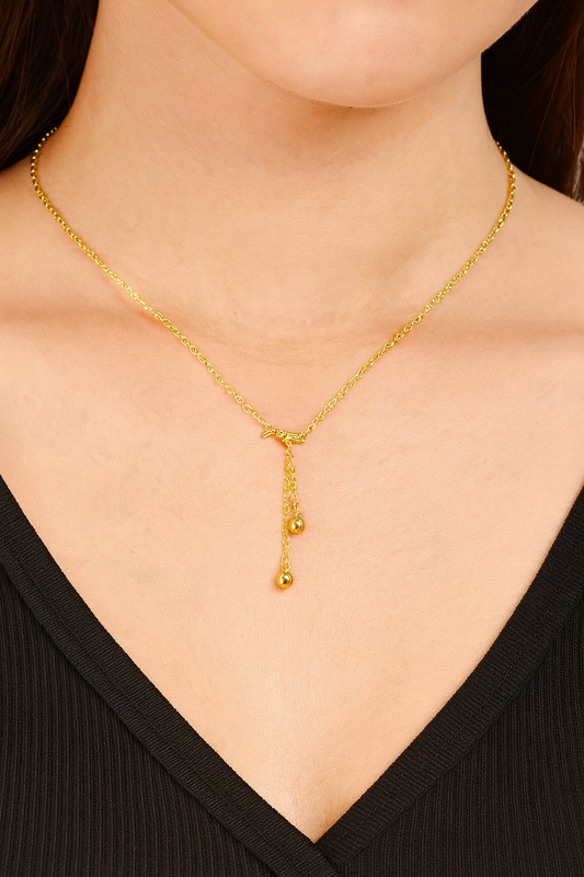 Golden Whisper Bow Pendant